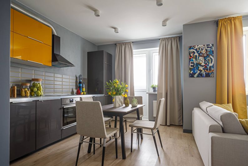 Interiérový dizajn obývačky a kuchyne v sivej farbe - foto