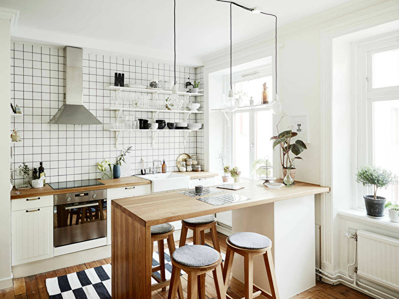 Cocina blanca de estilo escandinavo con barra de bar - diseño de interiores