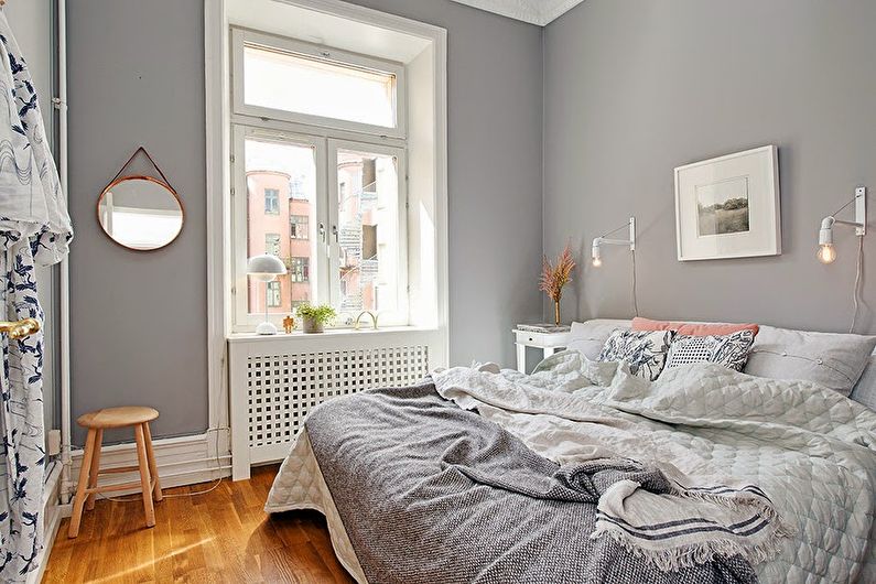 Diseño de un dormitorio pequeño en tonos grises - foto