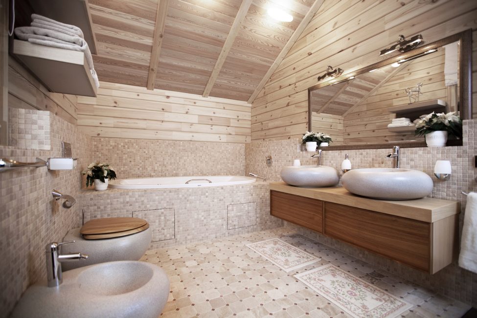 חדר אמבטיה יפה עם כיורי אבן ושירותים