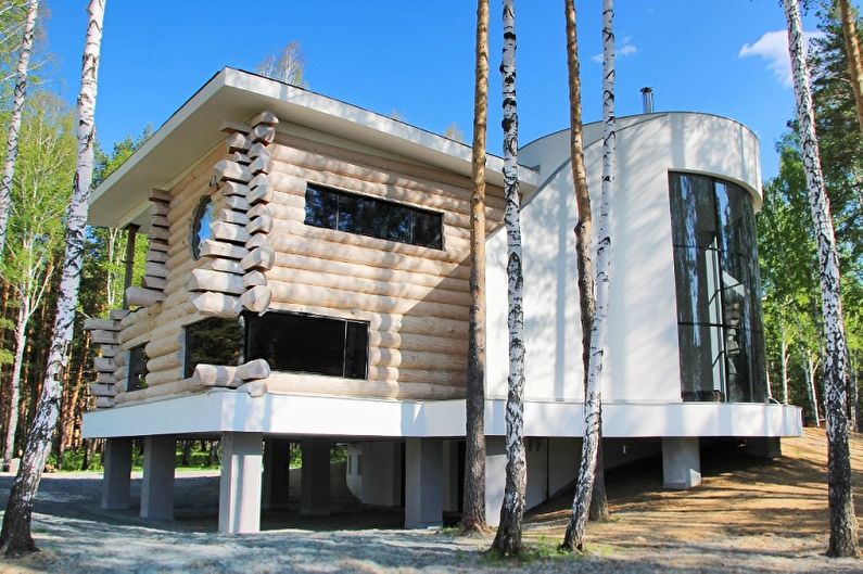Proyectos modernos de casas de una casa de troncos - Casa de un tronco redondeado en un estilo moderno