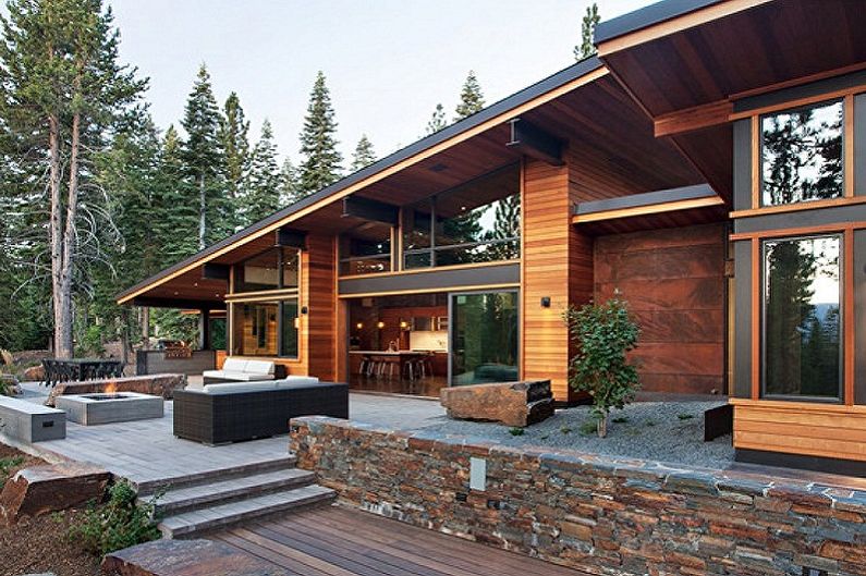 Moderne husdesign i chaletstil - Hytte med stor veranda