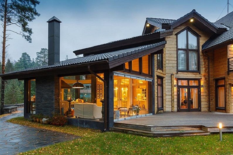 Moderne husdesign i chaletstil - Hytte med stor veranda
