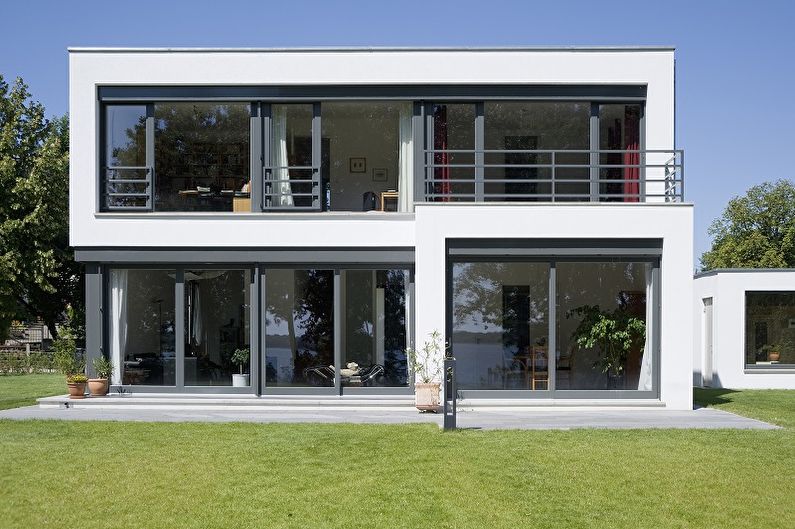 Nowoczesne projekty domów piętrowych - Dom piętrowy z panoramicznymi oknami