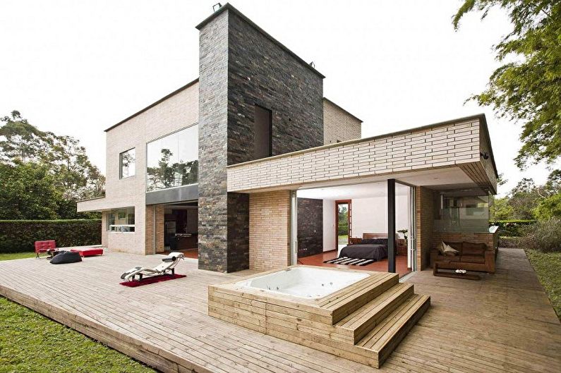 Ideias para layouts de casas de tijolos - minimalismo moderno em uma casa de tijolos