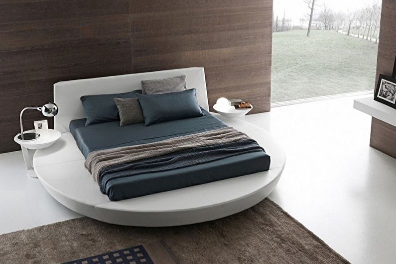 Vrste okroglih postelj v spalnici - Pravokotna postelja na okroglem podiju