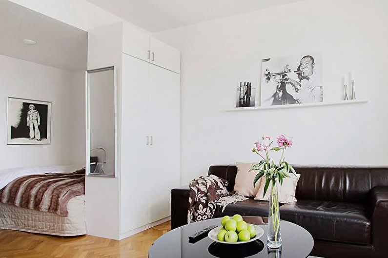 Mobiliario: zonificación de la habitación en el dormitorio y la sala de estar.
